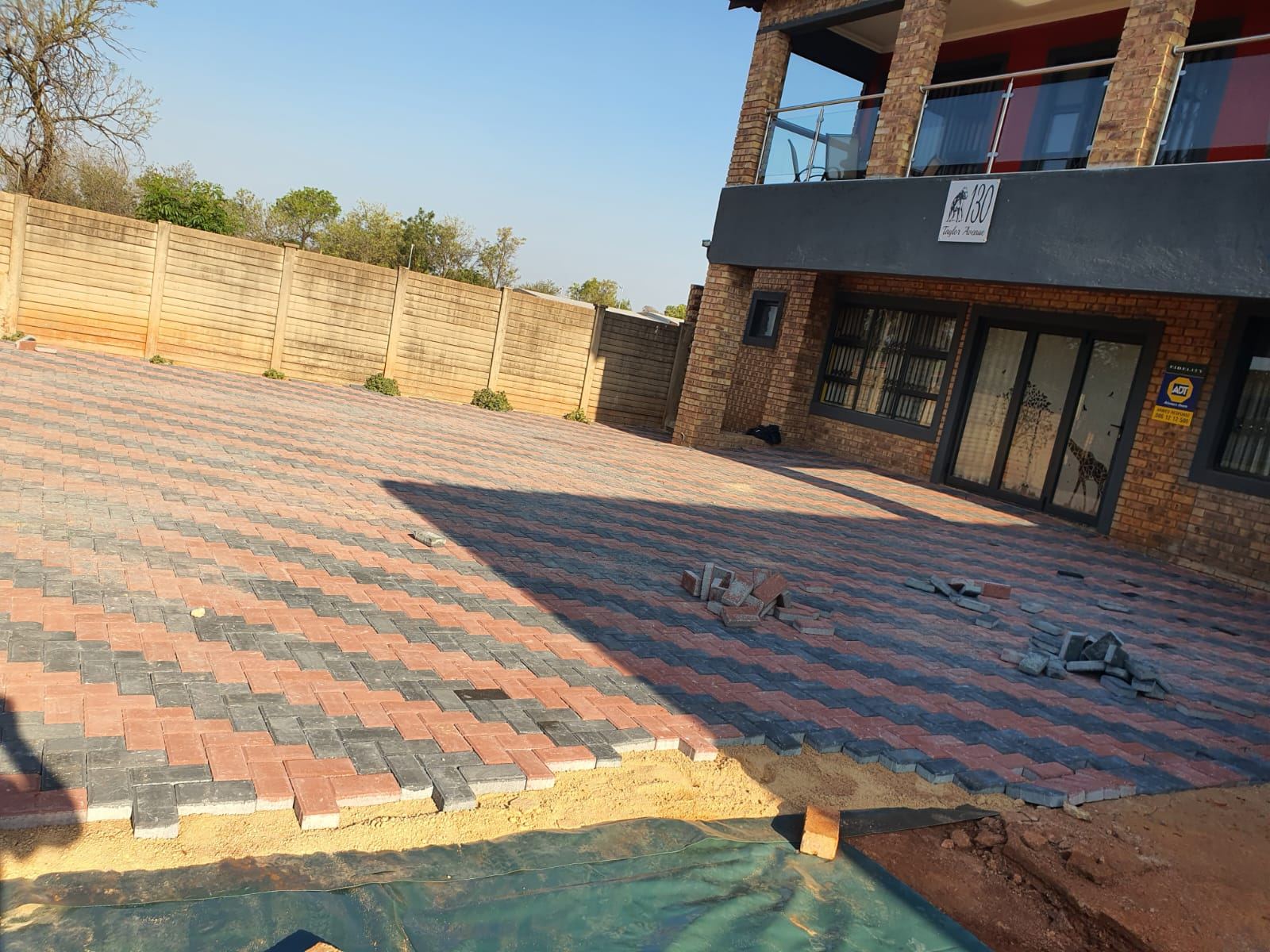 Paved courtyard around a pool